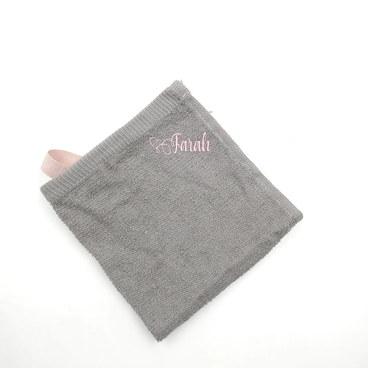 Gray towel with pink text Customized gifts for all occasions Amman Jordan