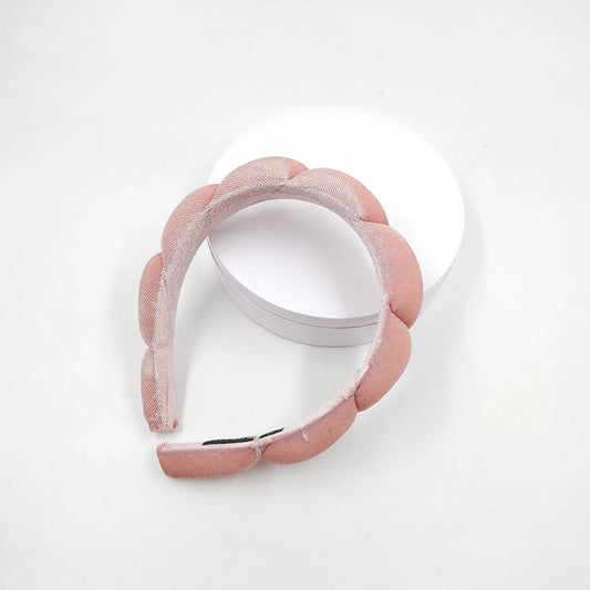 Pink headband on a white background