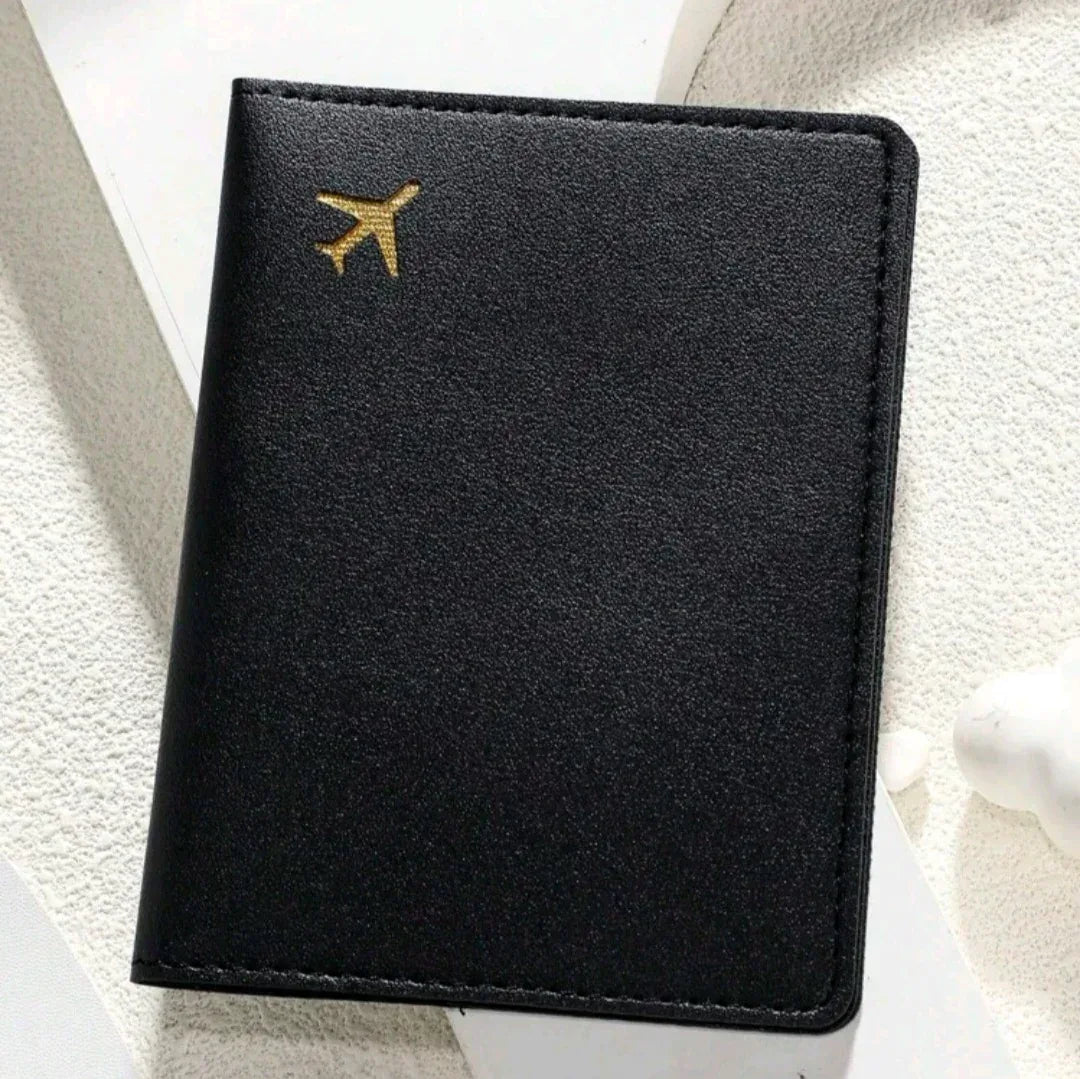 Black passport holder with gold airplane emblem Unique gift ideas Amman Jordan