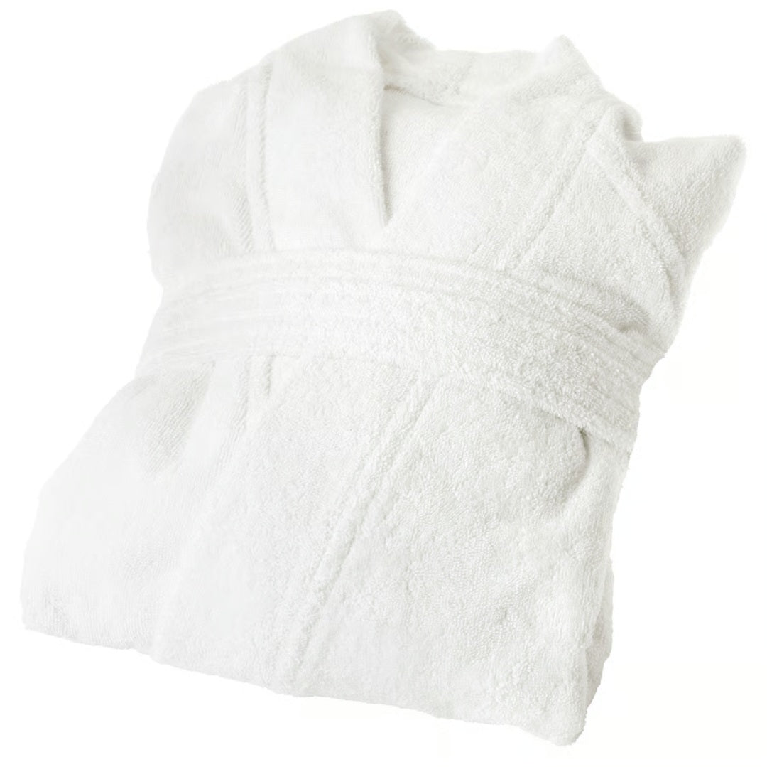 Folded white bathrobe on a white background