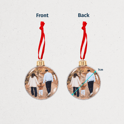 Personalized Christmas photo ornaments featuring a family photo in round and snowflake-shaped clear decorations with red hanging ribbons.