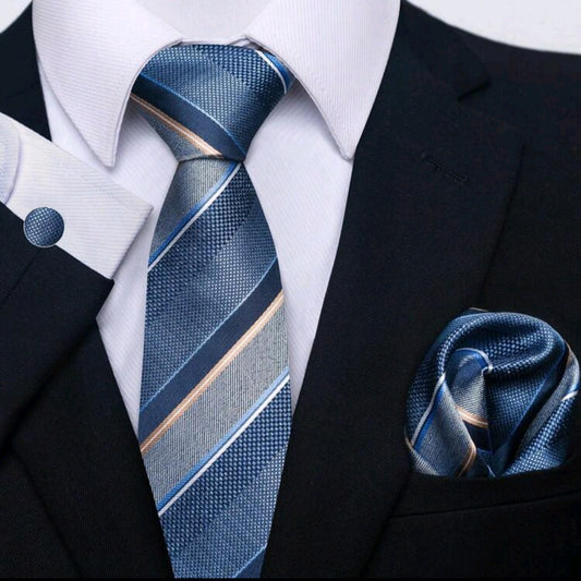 Blue striped tie and matching pocket square on a suit